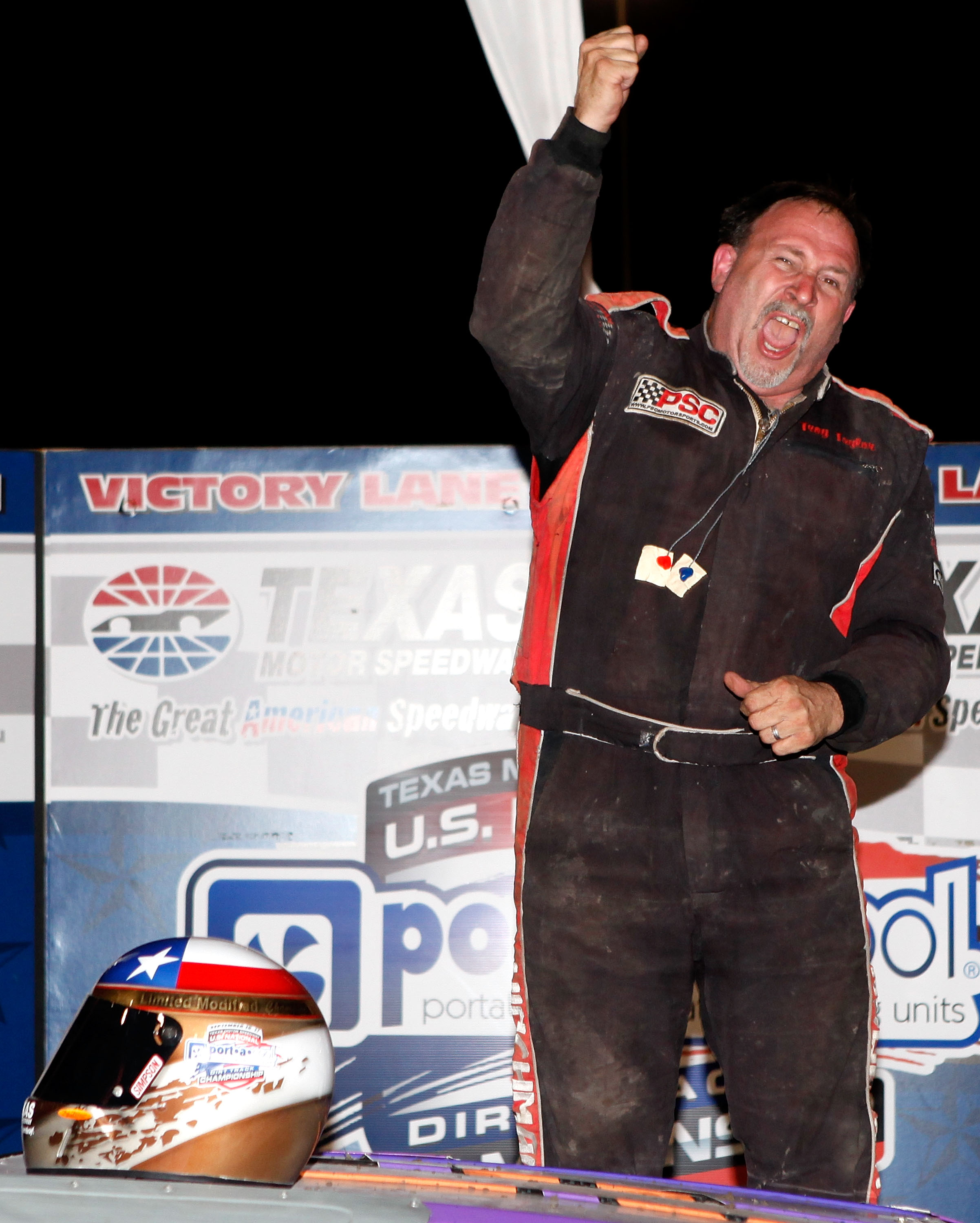 FORT WORTH, TX - SEPTEMBER 17: Troy Taylor, driver of the #56 Limited Modified class celebrates after winning the Port-A-Cool U.S. National Dirt Track Championship at Texas Motor Speedway on September 17, 2011 in Fort Worth, Texas. (Photo by Sean Gardner/Getty Images for TMS).